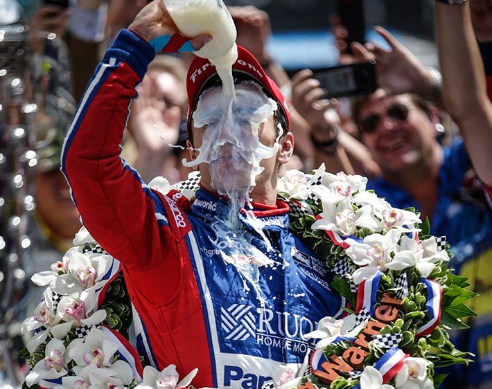 Indy 500 winner pouring milk on his face