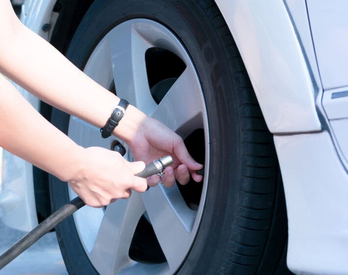 Pump air into clearance tire