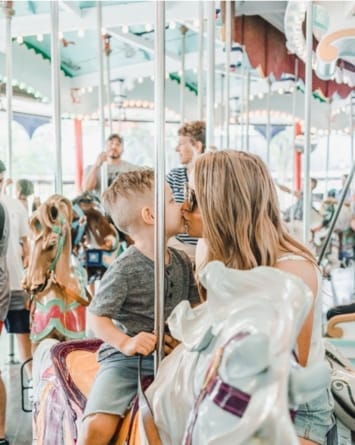 Mom and son on a carousel