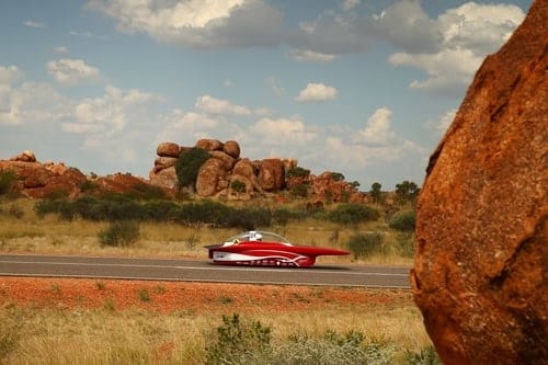 Red solar car in the desert