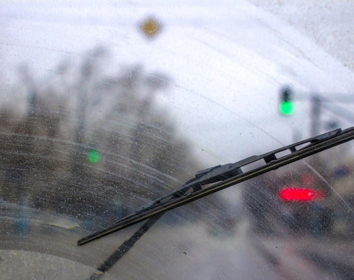 Inside car view of wiper on a dirty windshield