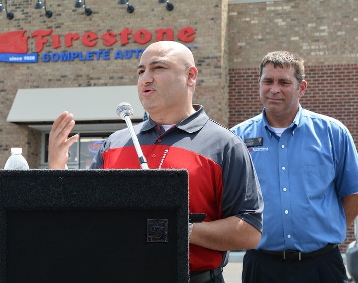 Firestone Complete Auto Care team member giving a speech