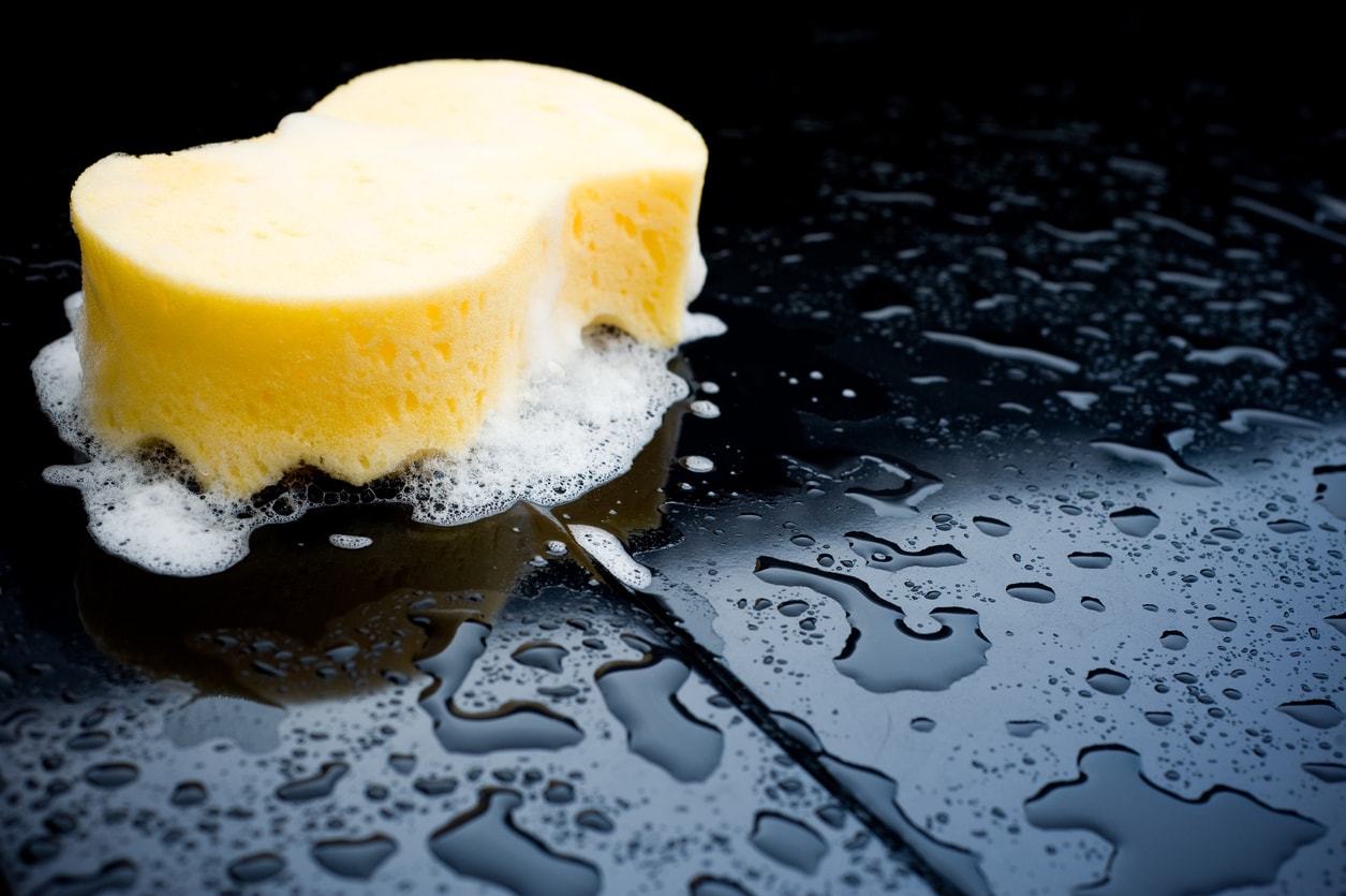 image of a sponge washing a car