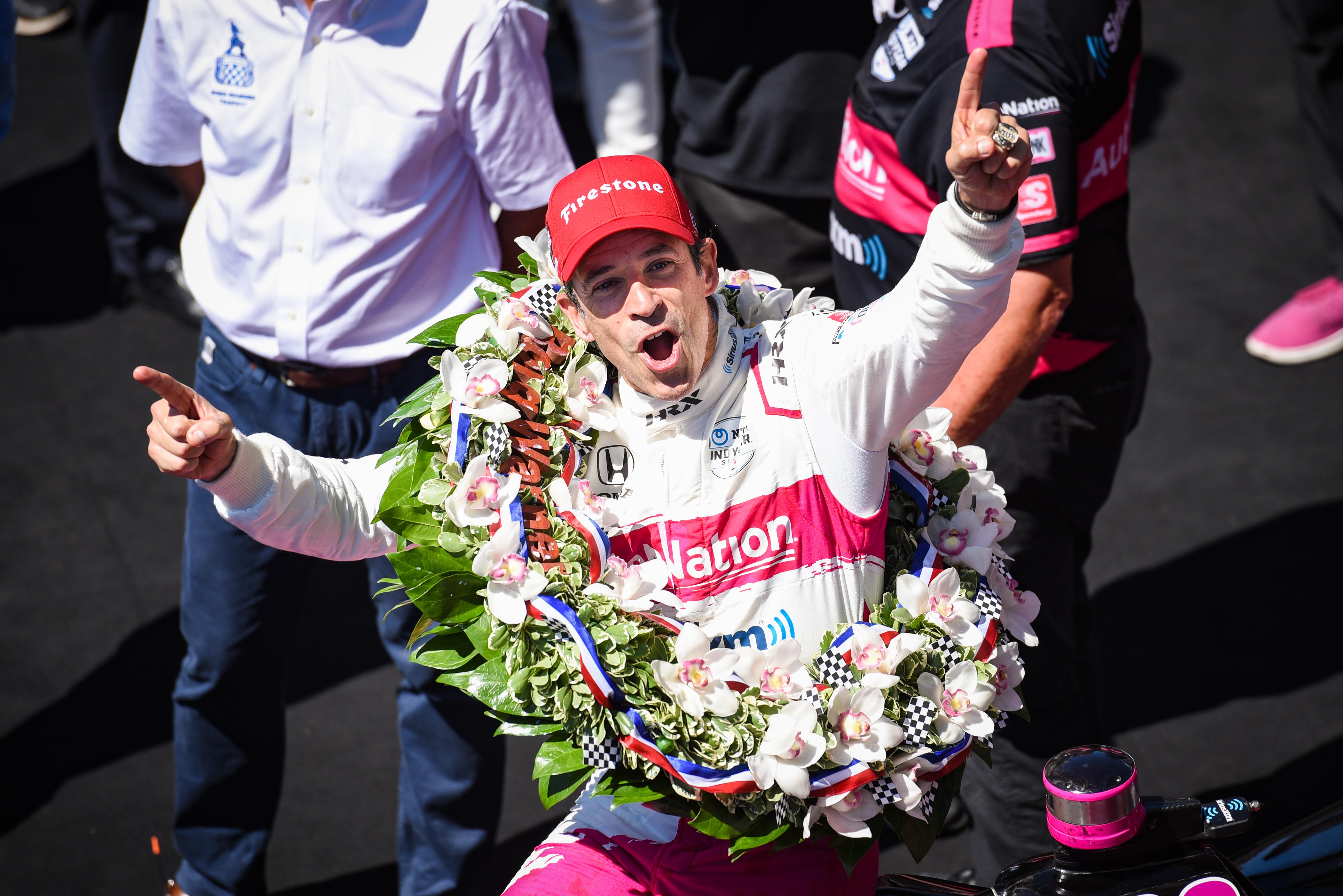 image of Helio Castroneves celebrating at Indy 500