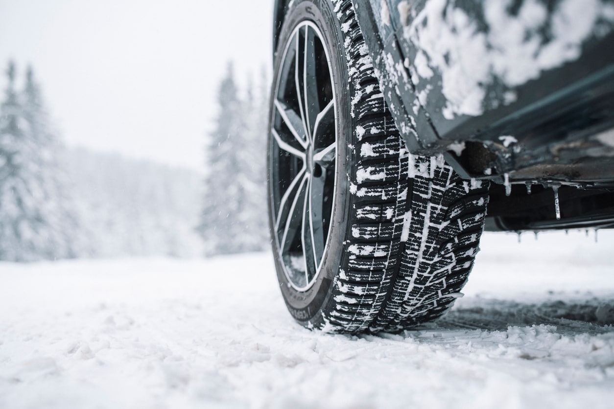 image of car tire on snowy road