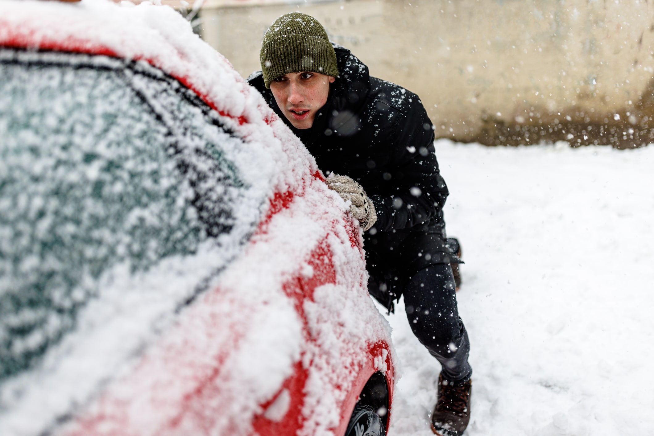 Man preparing car for winter drive